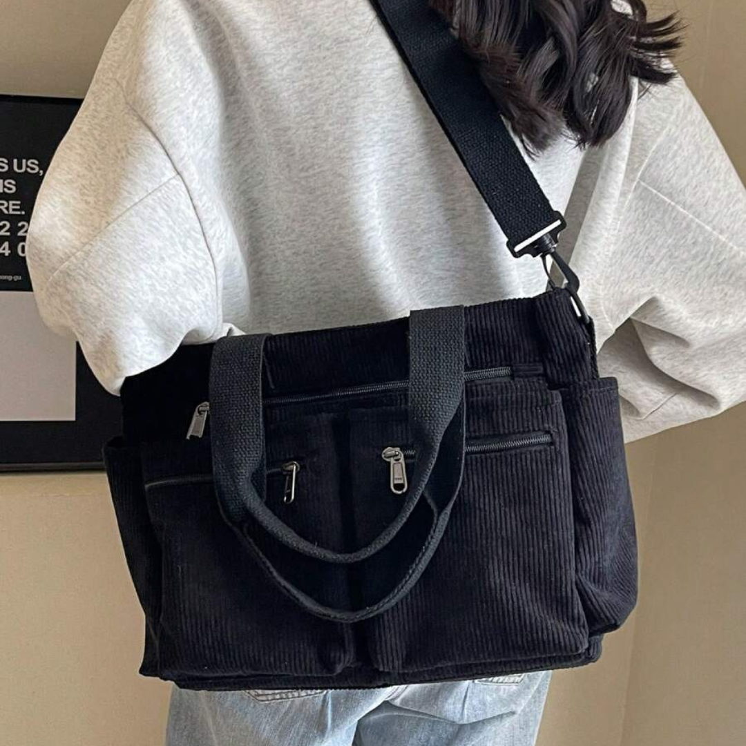 Bolso con varios compartimentos y diseño informal ideal para el día a día y para viajar®