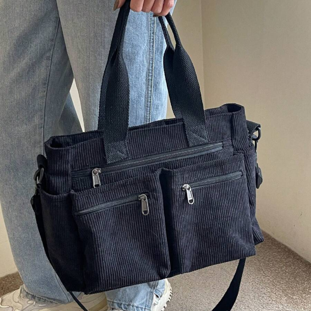 Bolso con varios compartimentos y diseño informal ideal para el día a día y para viajar®