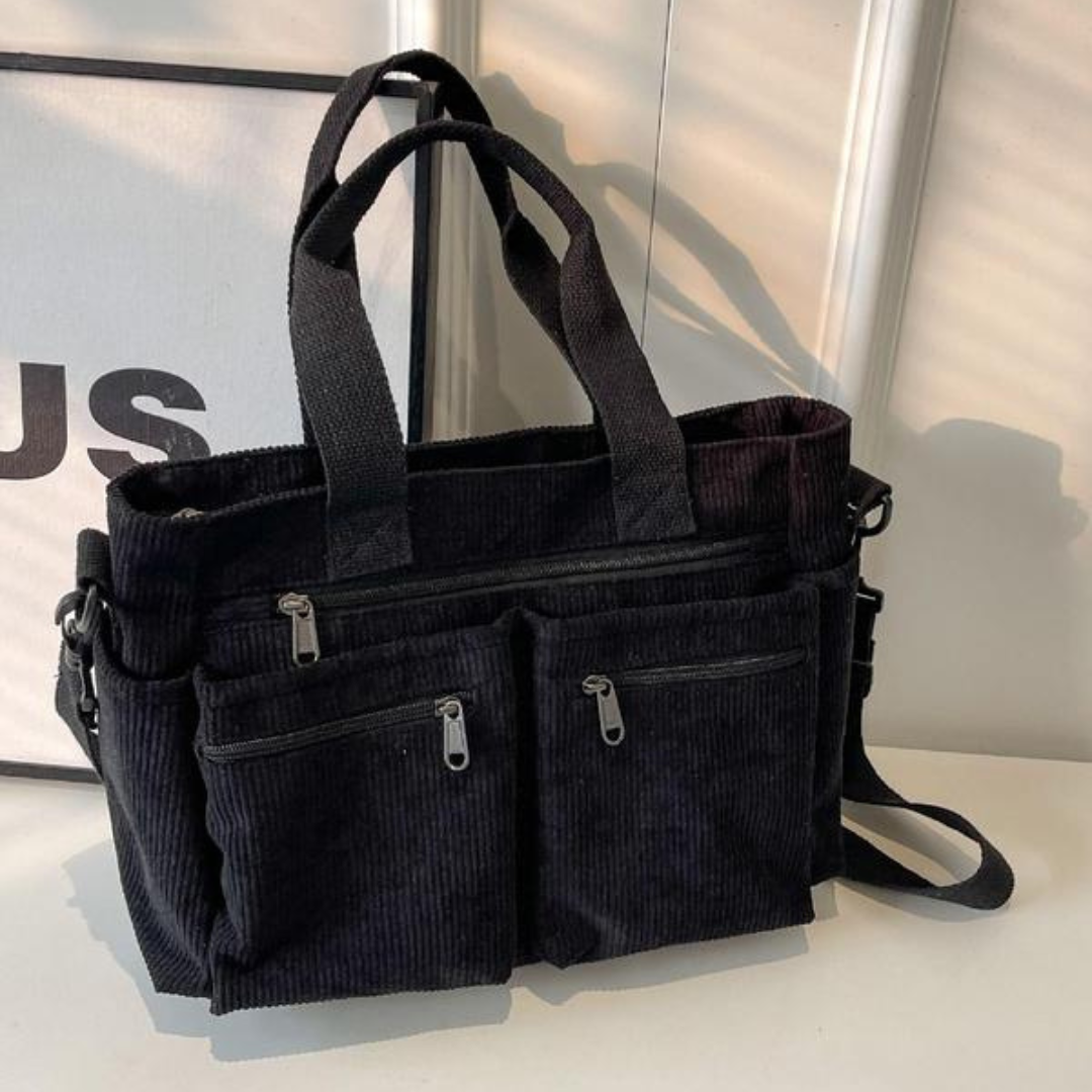 Bolso con varios compartimentos y diseño informal ideal para el día a día y para viajar®