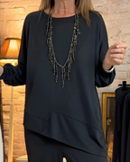 Jersey asimétrico de diseño elegante para mujer