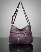 Bolso con múltiples compartimentos y textura suave®