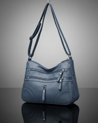 Bolso con múltiples compartimentos y textura suave®