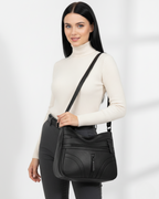 Bolso con múltiples compartimentos y textura suave®