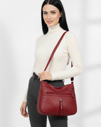Bolso con múltiples compartimentos y textura suave®